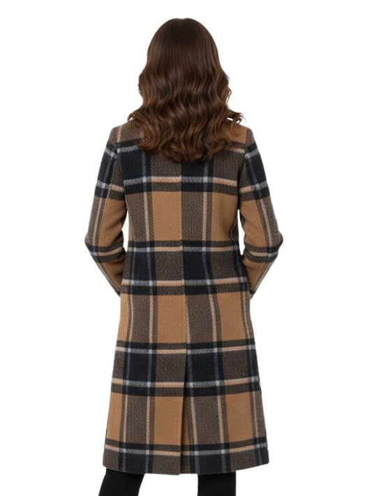 Woman wearing a plaid coat on a white background